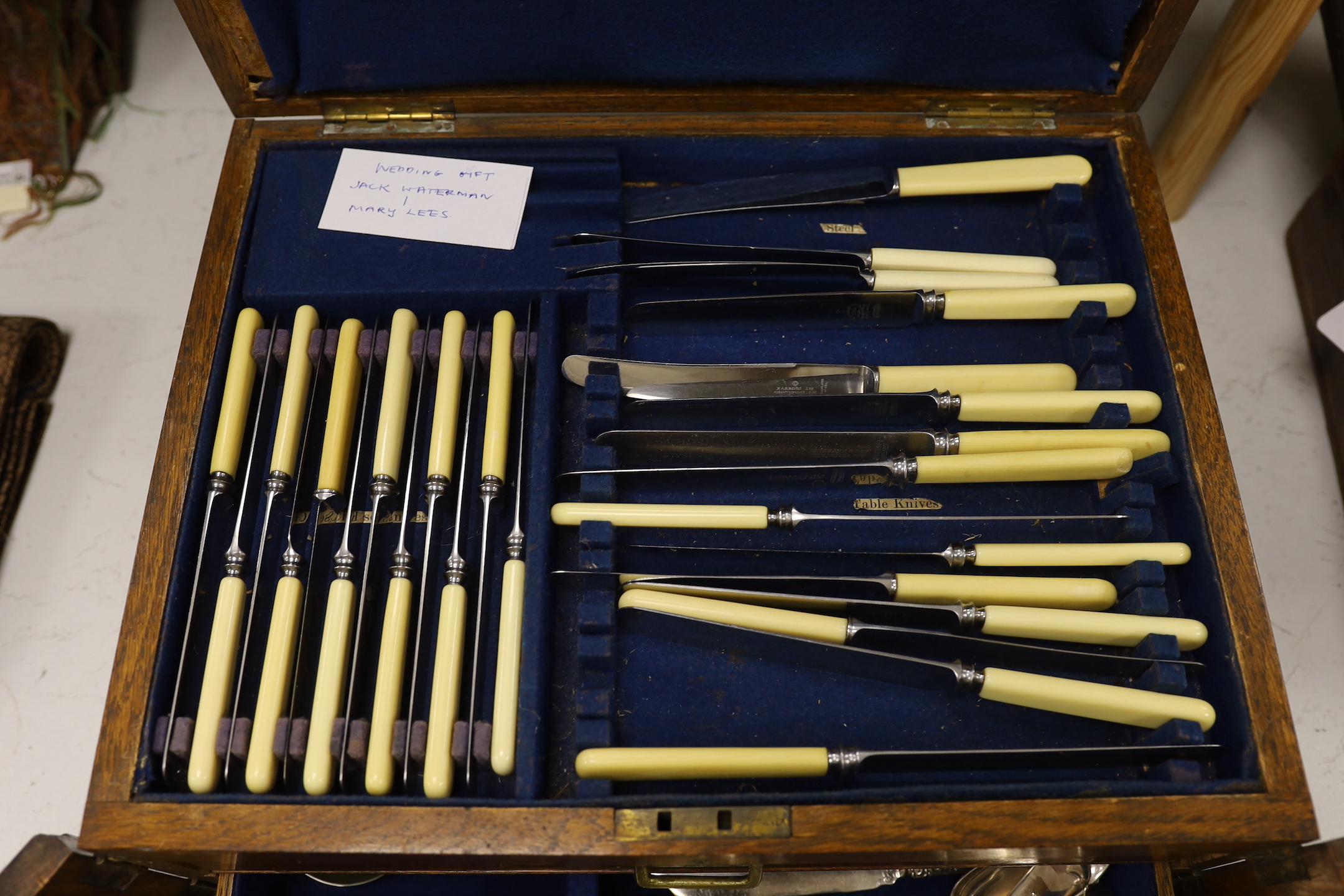 An oak part canteen of beaded Old English pattern flatware